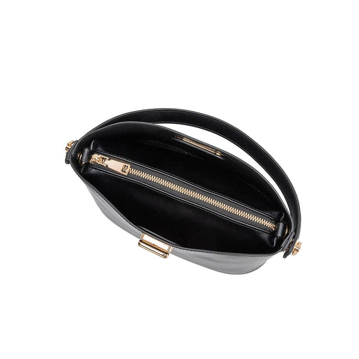 Black leather handbag with gold zipper and handle on a white background