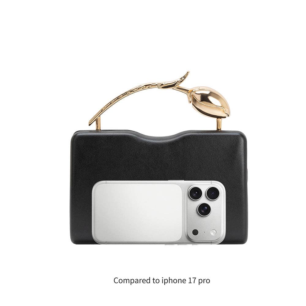 Black faux leather clutch with gold top handle compared to iPhone 17 Pro on a white background