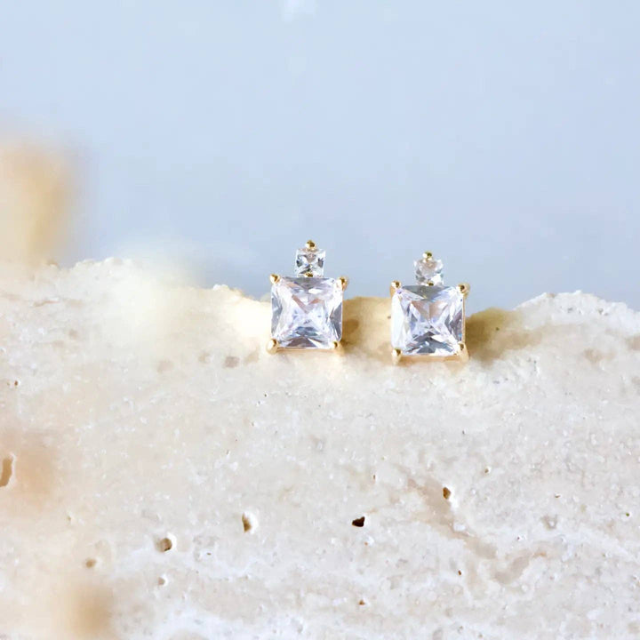 Gold CZ stud earrings.
