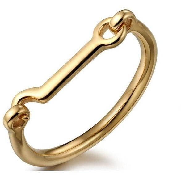 Gold horse-bit -shaped bangle bracelet on a white background