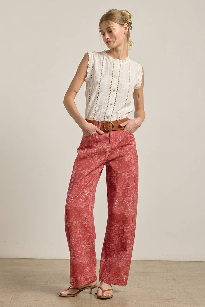 Woman wearing red wide leg paisley jeans with barrel shape