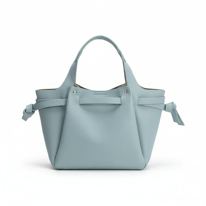 Light blue handbag with bow details on a white background