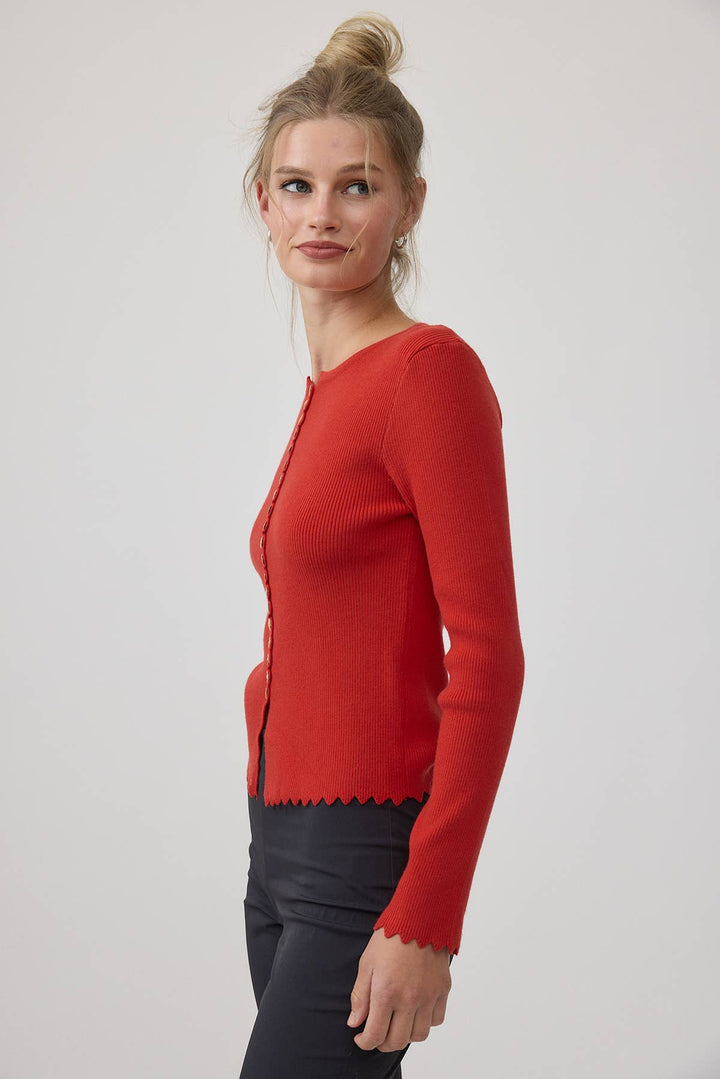 Woman wearing a red sweater on a white background
