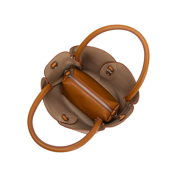 Brown woven raffia leather handbag with matching handle on a white background