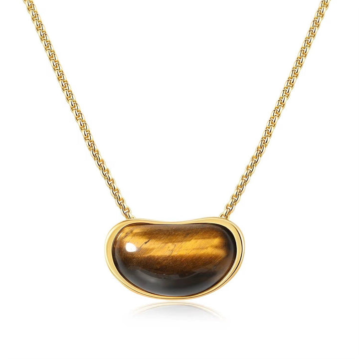 Necklace with a tiger's eye stone pendant on a gold chain against a white background