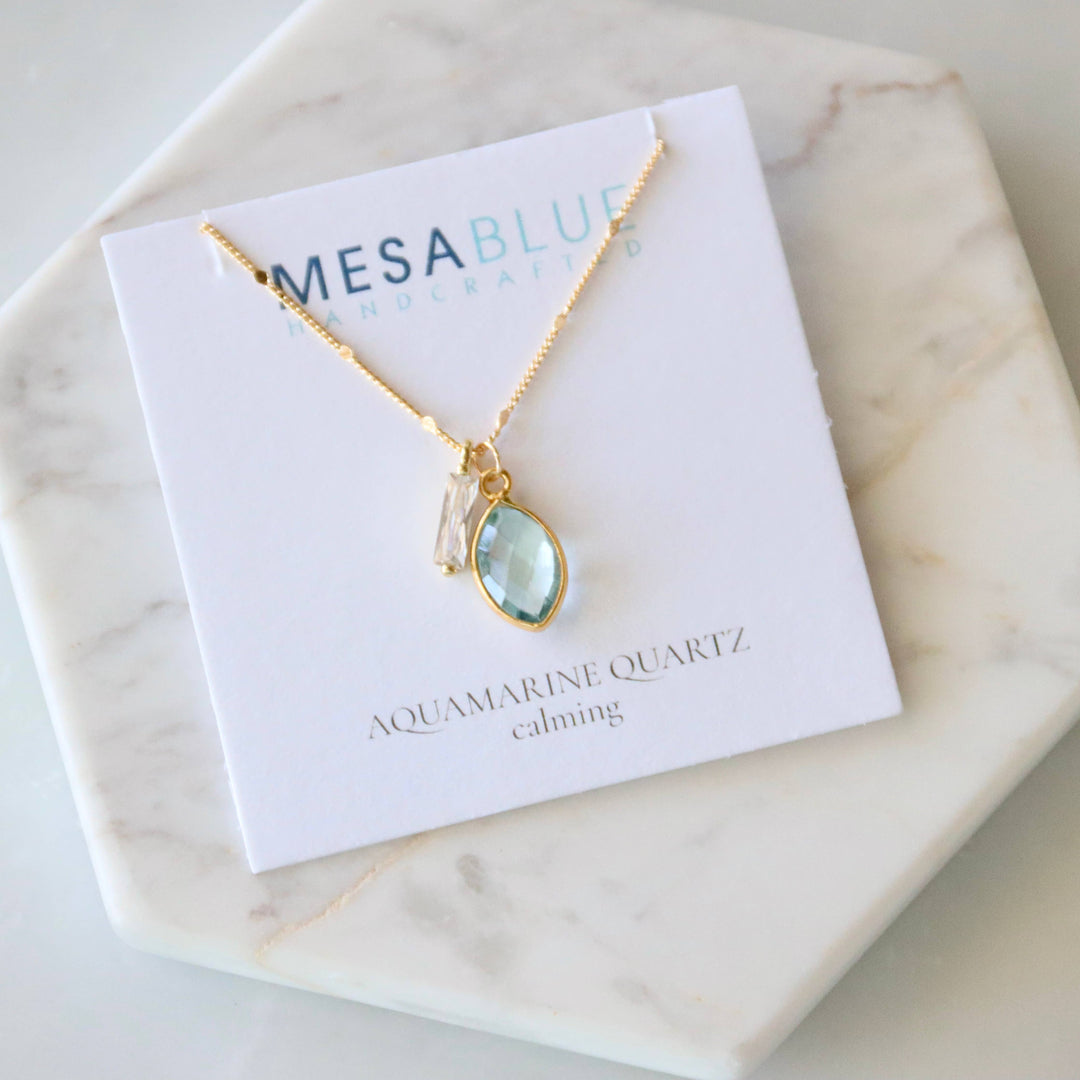 Necklace with aquamarine pendant on a Mesablue card