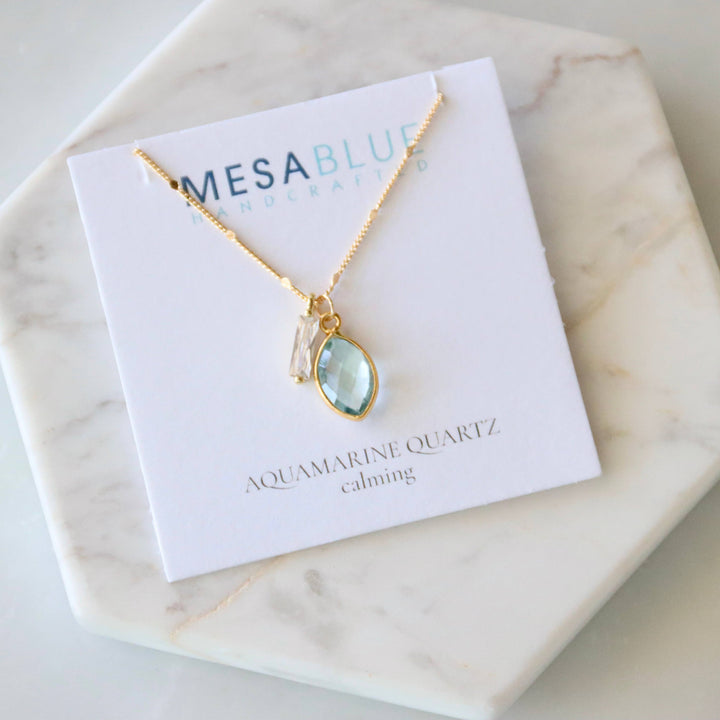Necklace with aquamarine pendant on a Mesablue card