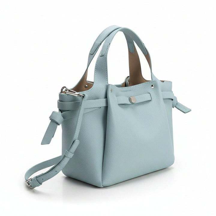 Light blue shoulder handbag with optional strap on a white background