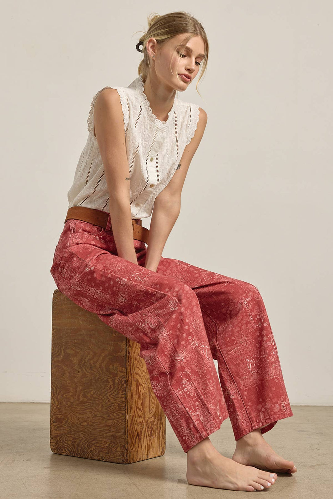 Woman wearing red patterned wide leg barrel shaped denim
