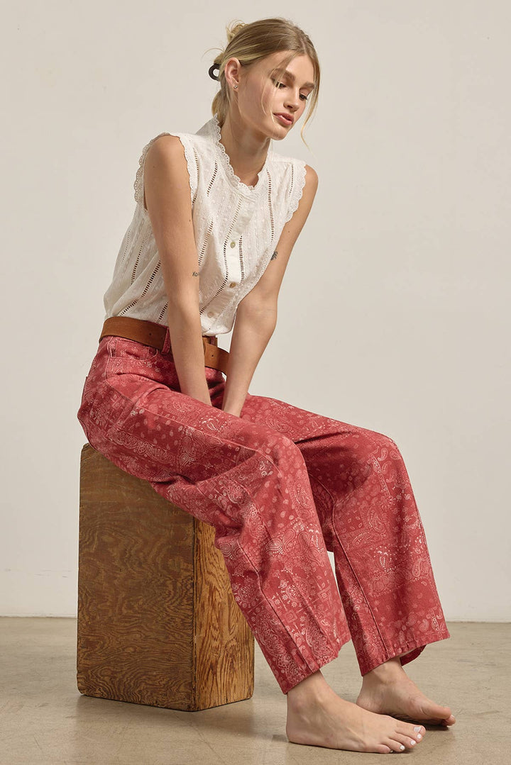 Woman wearing red patterned wide leg barrel shaped denim
