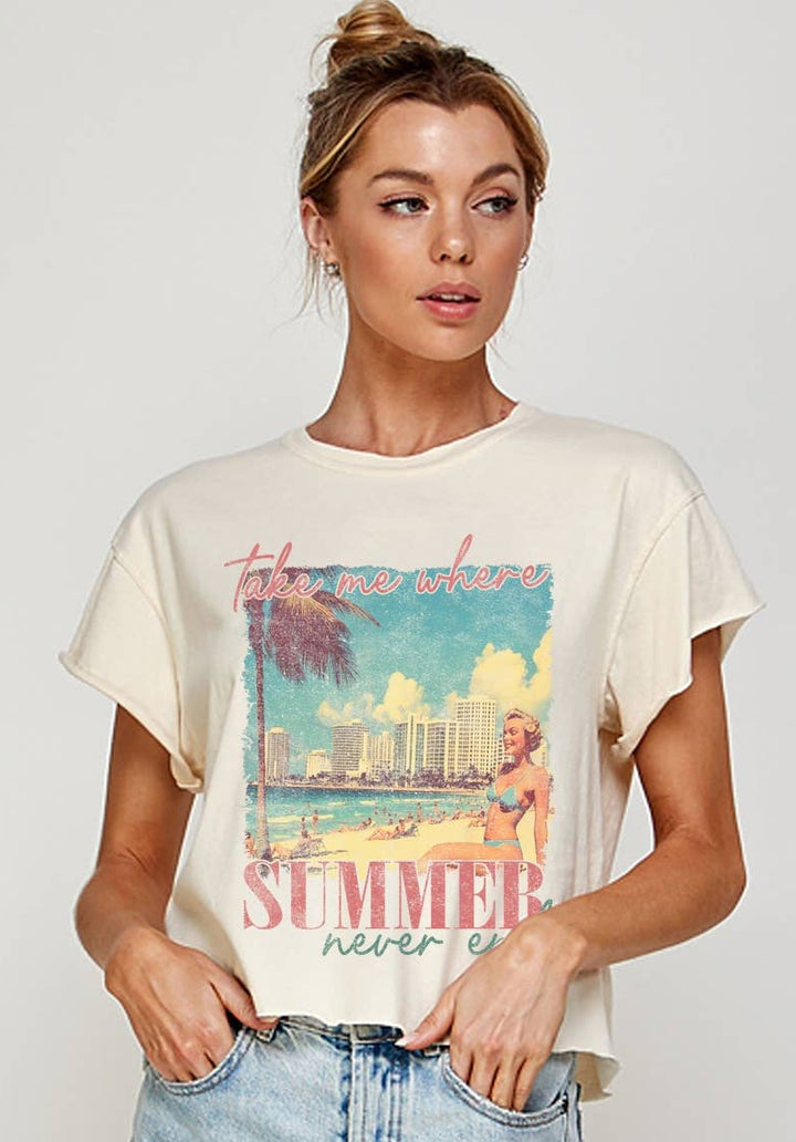 Woman wearing a cream t-shirt with a graphic design and text, standing against a plain background.