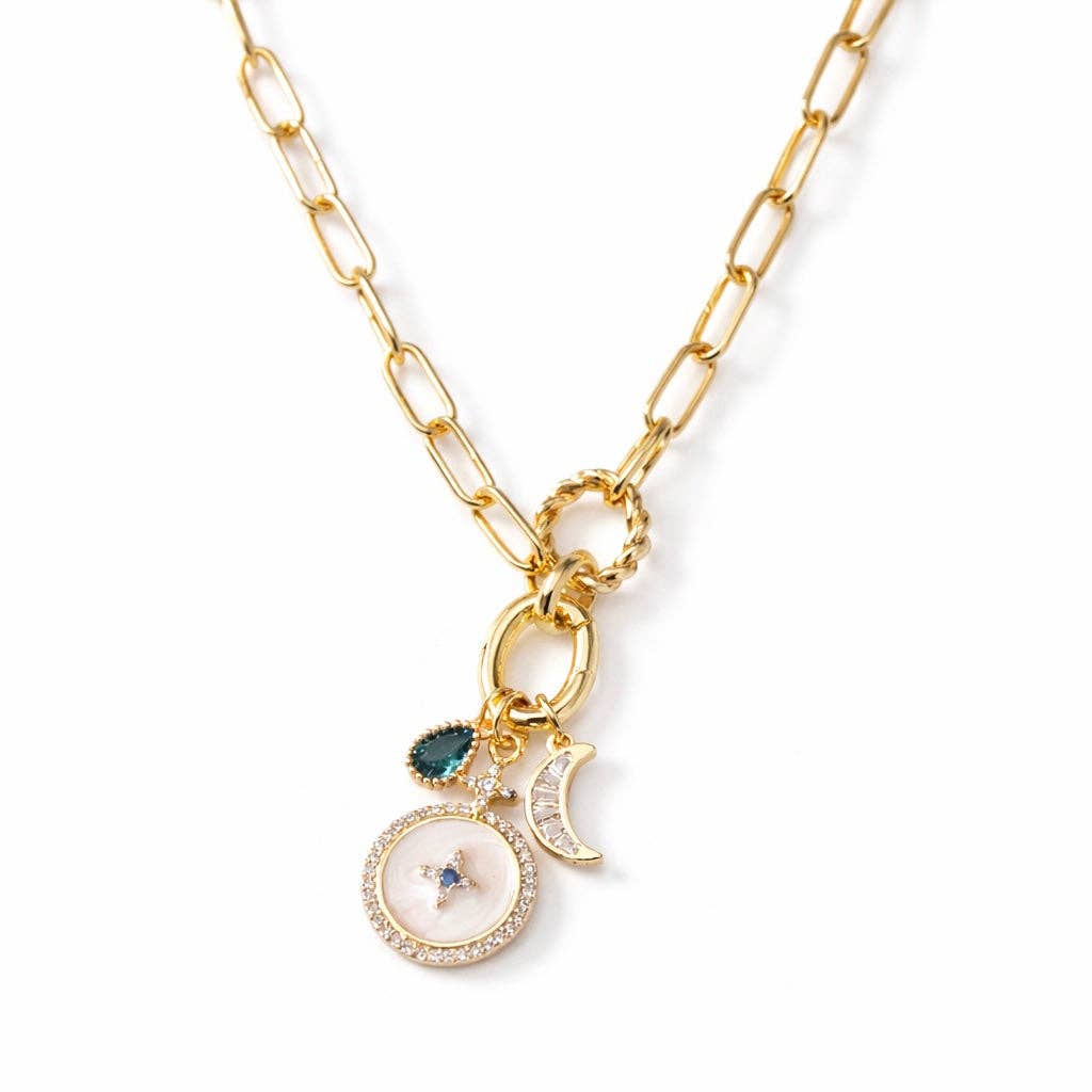 Gold necklace with charms on a white background