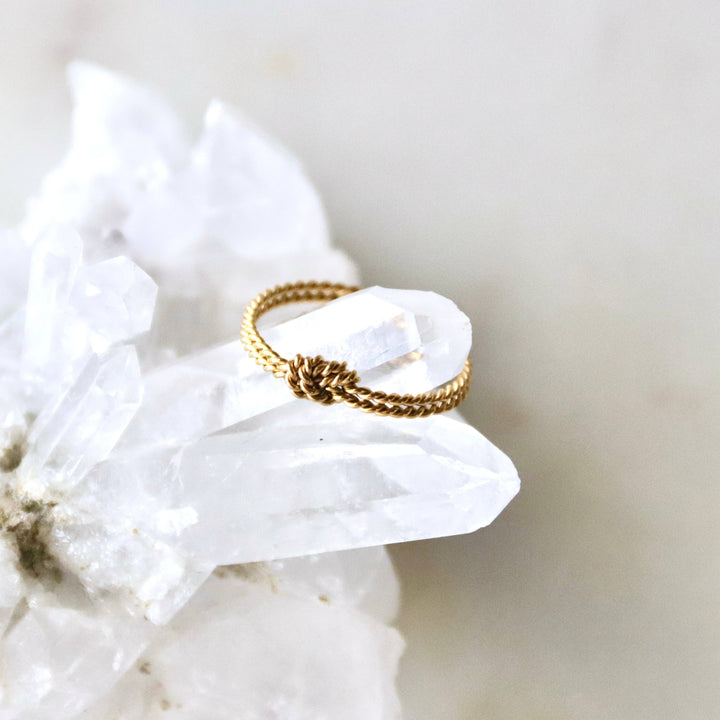Gold stacking ring with knot design