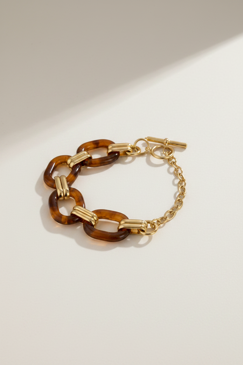 Gold and amber waterproof and tarnish resistant chain bracelet on a white background