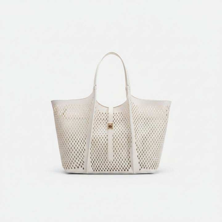 Perforated white tote bag with gold accent on a white background