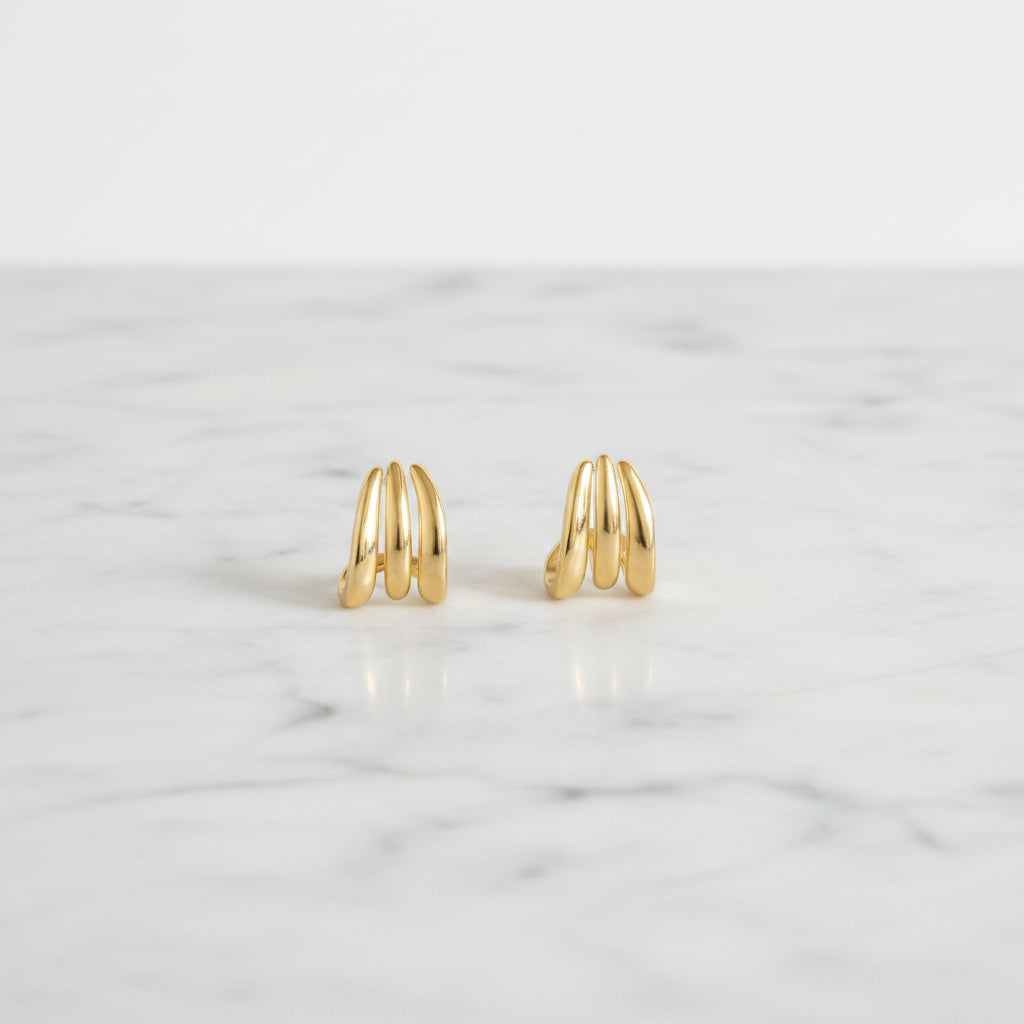 Gold hoop earrings on a white background