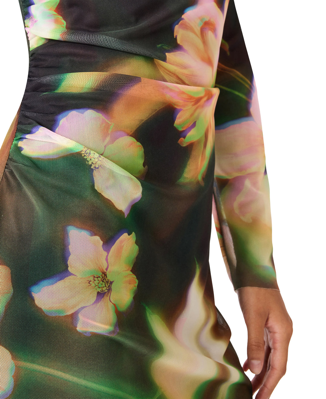 A close-up of a long-sleeve dress featuring a dark base with a vibrant, iridescent floral print in pink, green, and yellow tones, shown on a model against a white background.