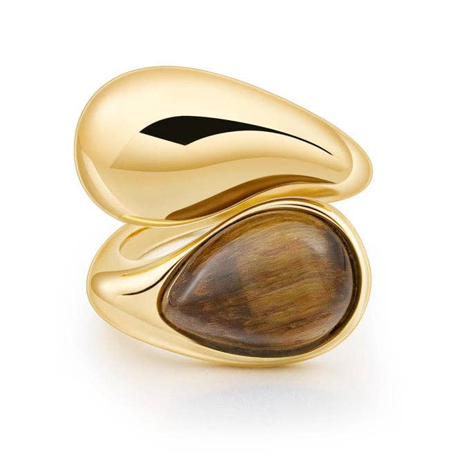 Gold ring with a tiger's eye stone inlay on a white background