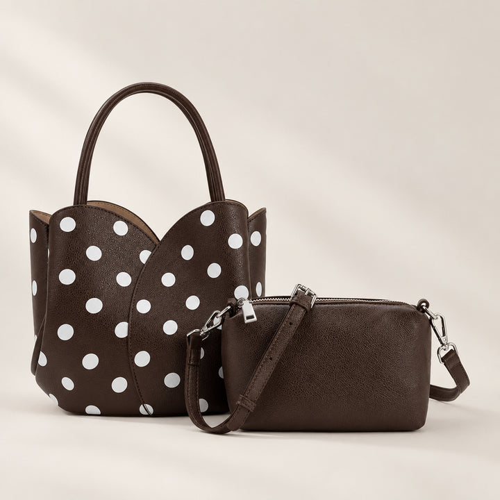 A dark brown vegan leather handbag set featuring a large handbag with white polka dots and a matching small crossbody pouch, both shown on a plain white background.