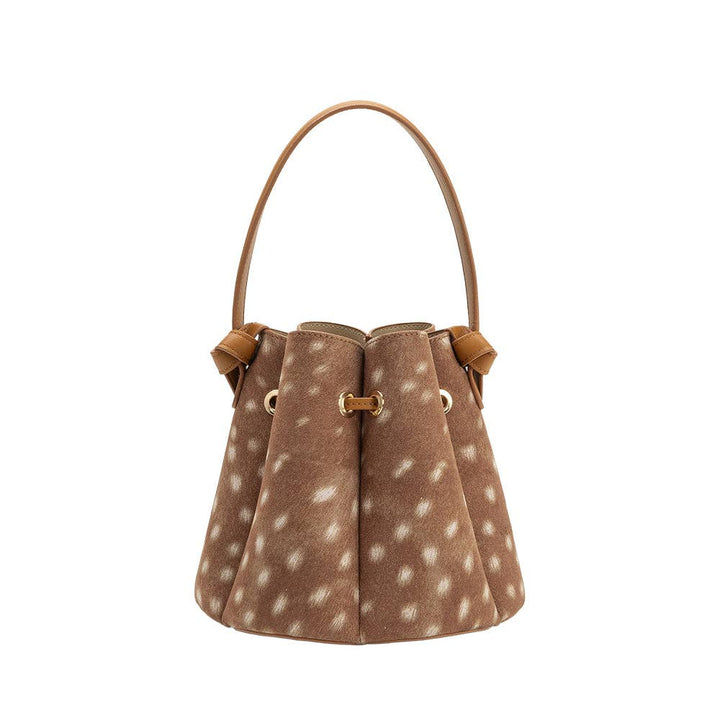Brown bambi print handbag with leather accents on a white background