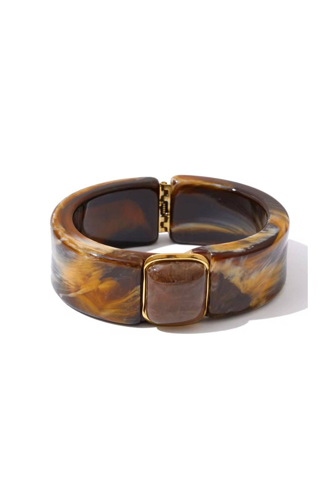 Tortoiseshell bracelet with a gold clasp on a white background