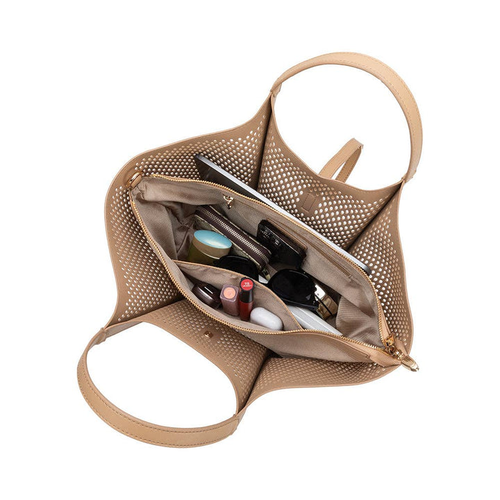 Beige handbag with mesh interior showing various items on a white background