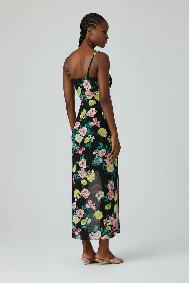 Woman wearing a floral dress on a white background