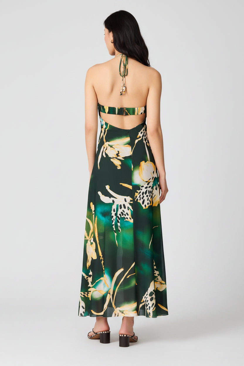 Woman wearing a floral long dress with a white background